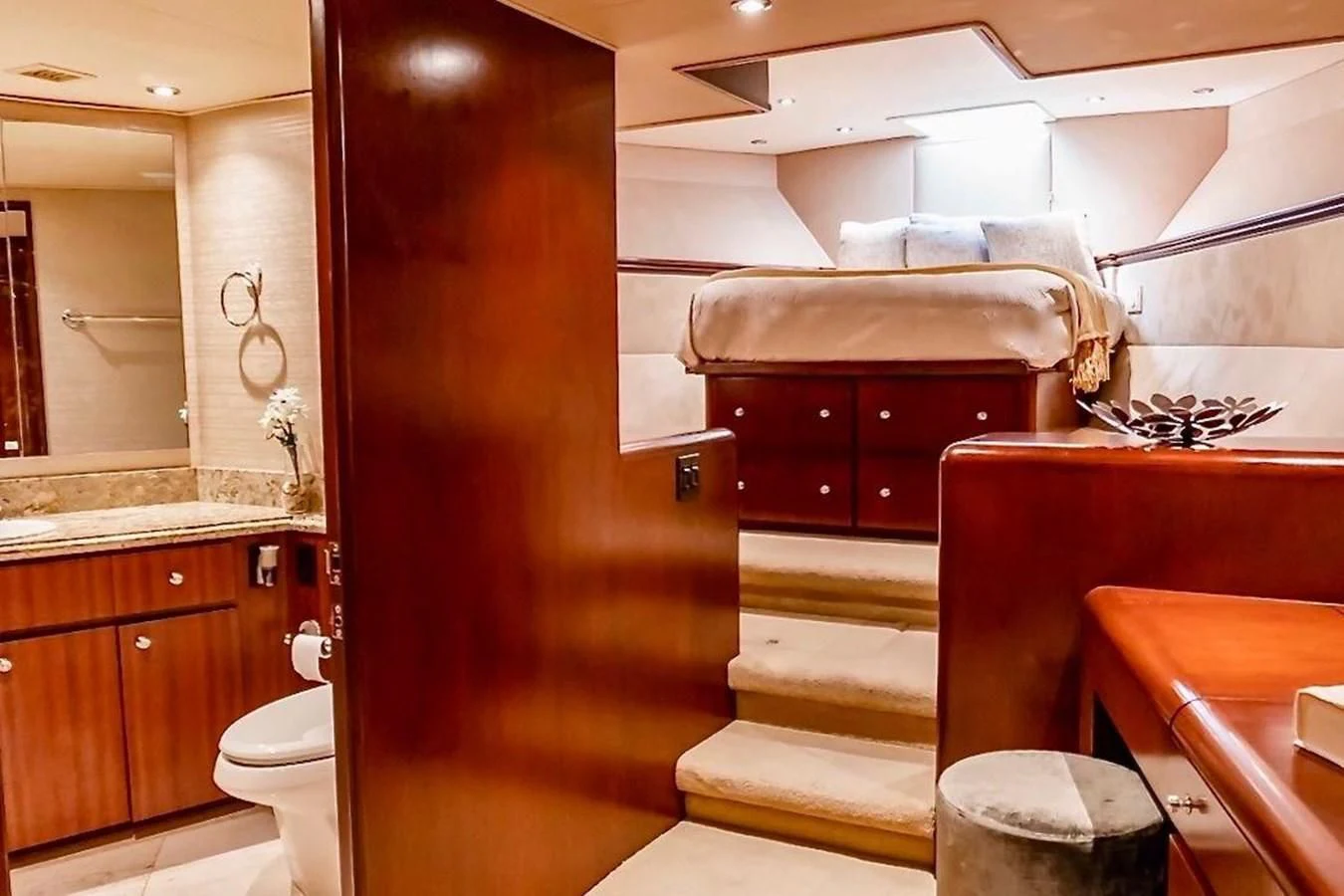 a bathroom with a tub sink and toilet aboard THREE KINGS Yacht for Sale