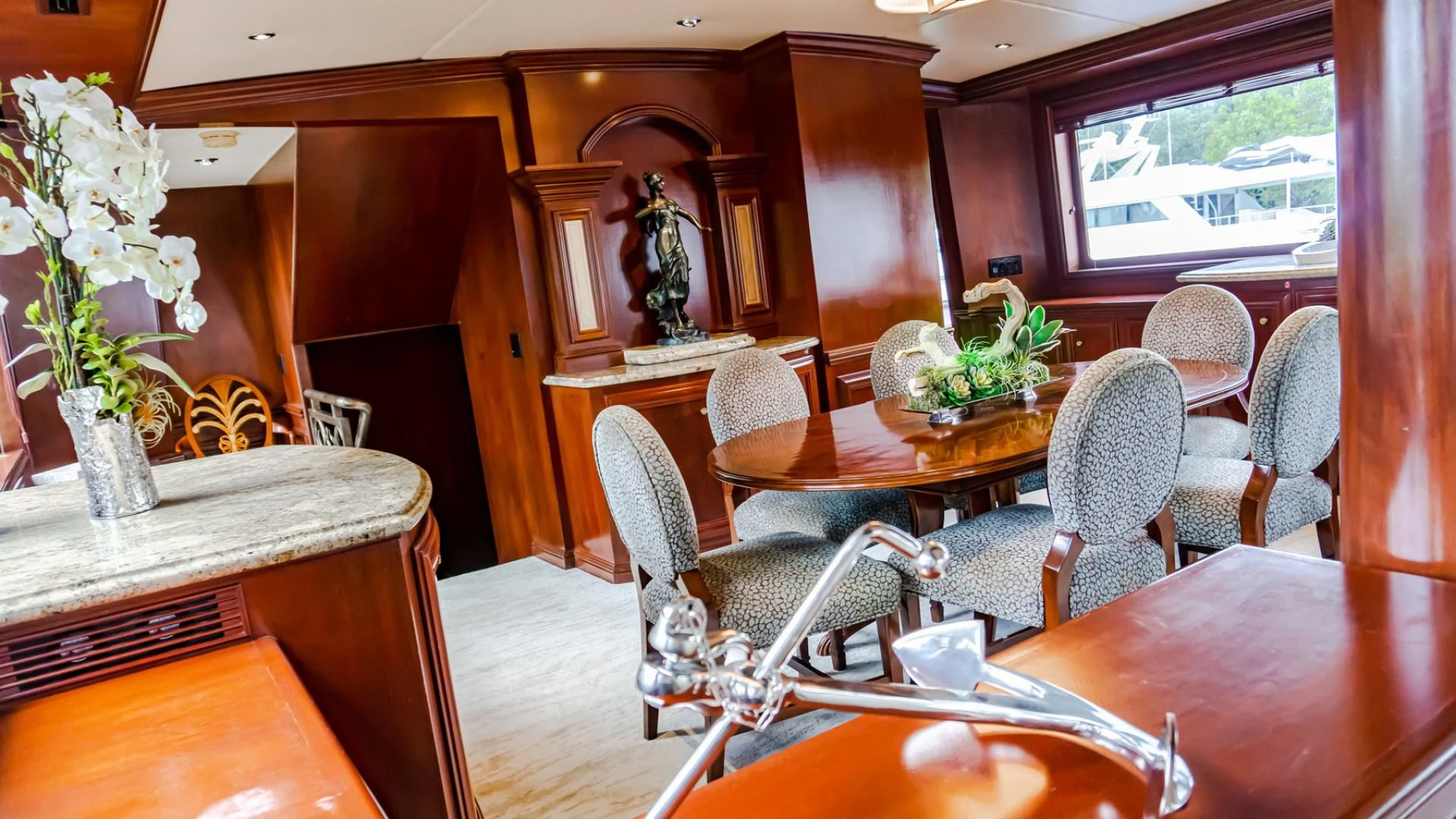 a dining room with a table and chairs aboard THREE KINGS Yacht for Sale