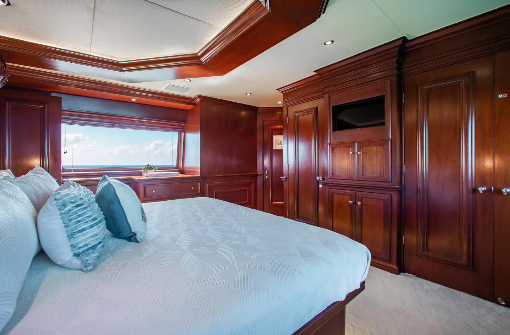 a bed in a room aboard THREE KINGS Yacht for Sale