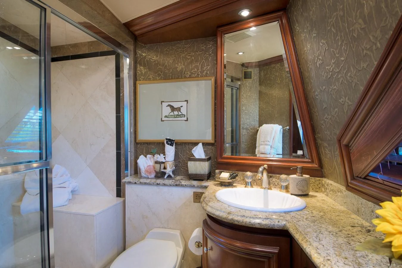 a bathroom with a sink and a mirror aboard THREE KINGS Yacht for Sale
