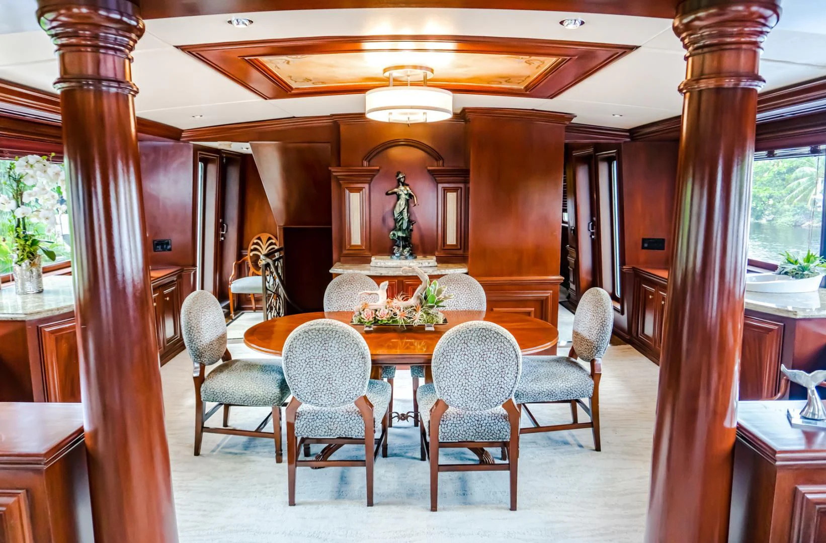 a room with a table chairs and a large window aboard THREE KINGS Yacht for Sale