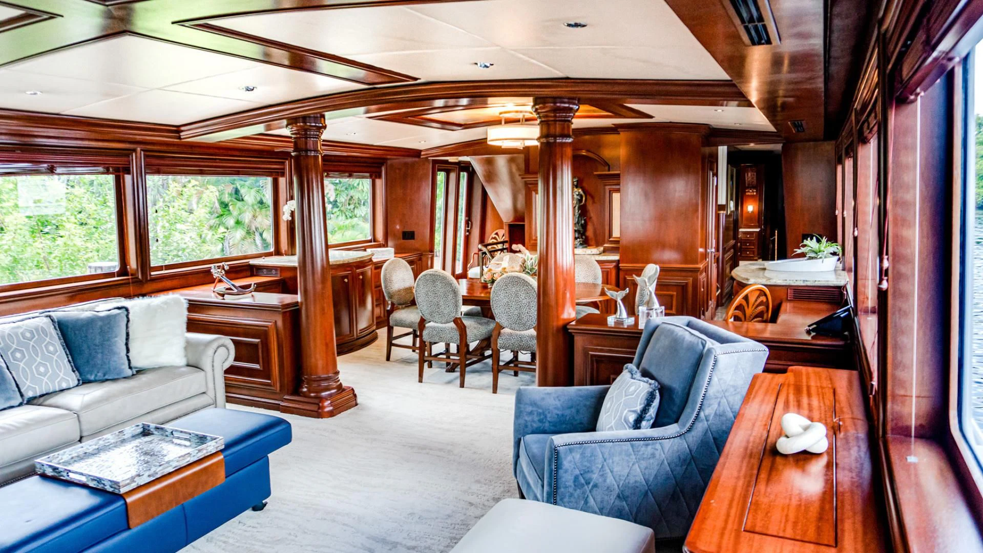 a living room with a couch and a table aboard THREE KINGS Yacht for Sale