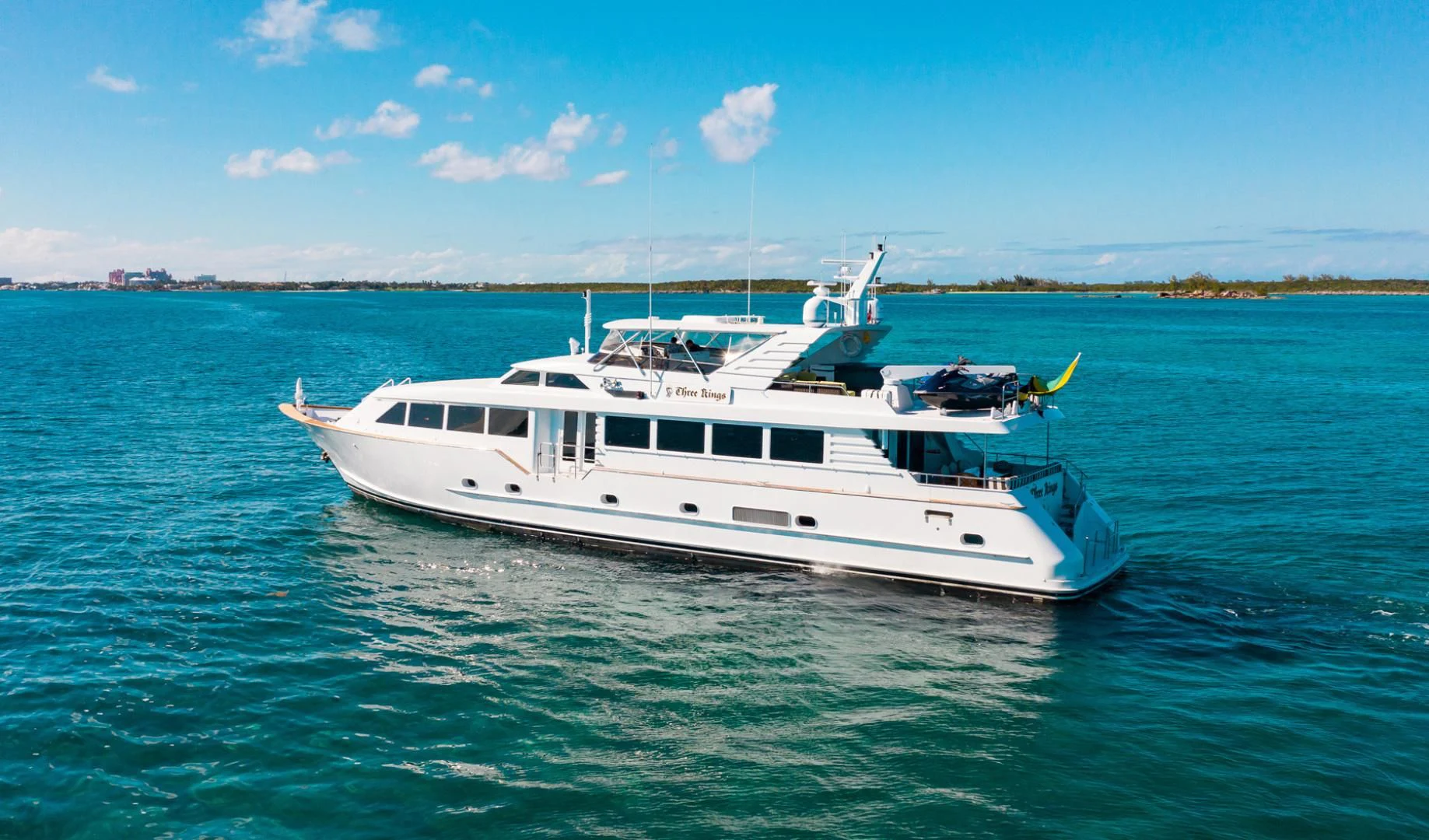 a white boat in the water aboard THREE KINGS Yacht for Sale
