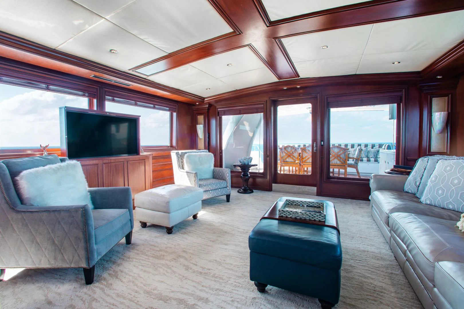 a living room with a large window aboard THREE KINGS Yacht for Sale