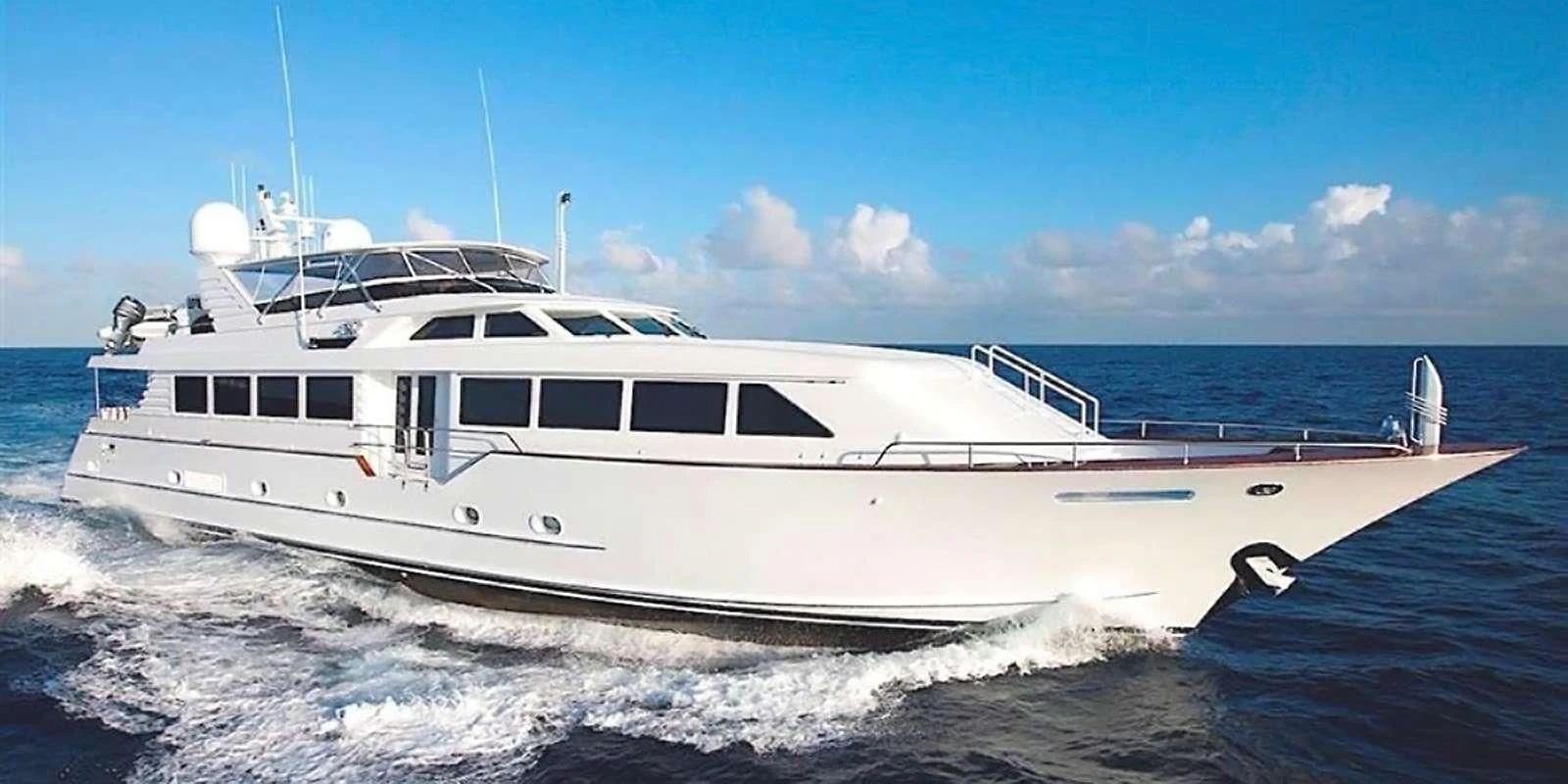 a white yacht on the water aboard THREE KINGS Yacht for Sale
