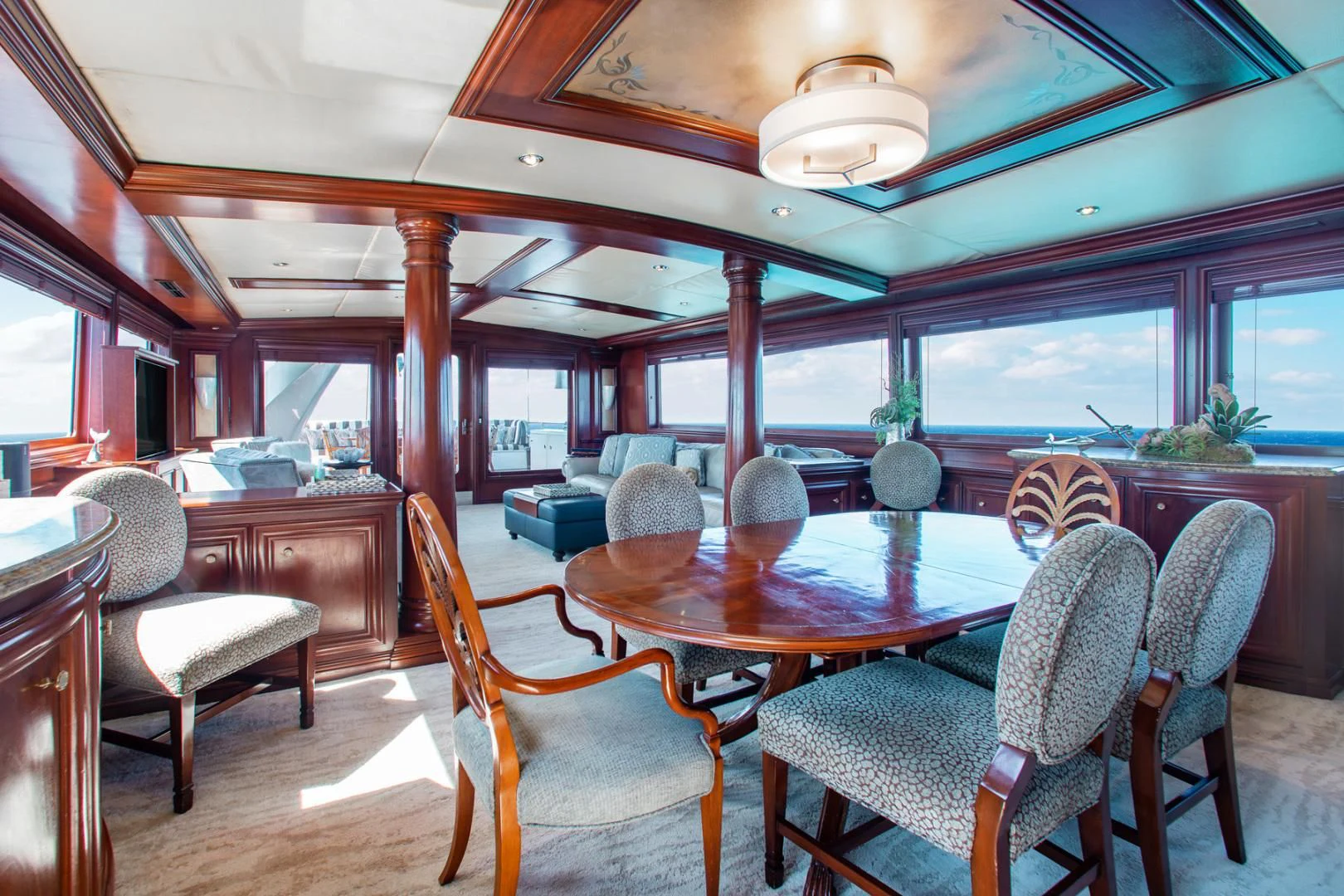 a large dining room with a large table and chairs aboard THREE KINGS Yacht for Sale