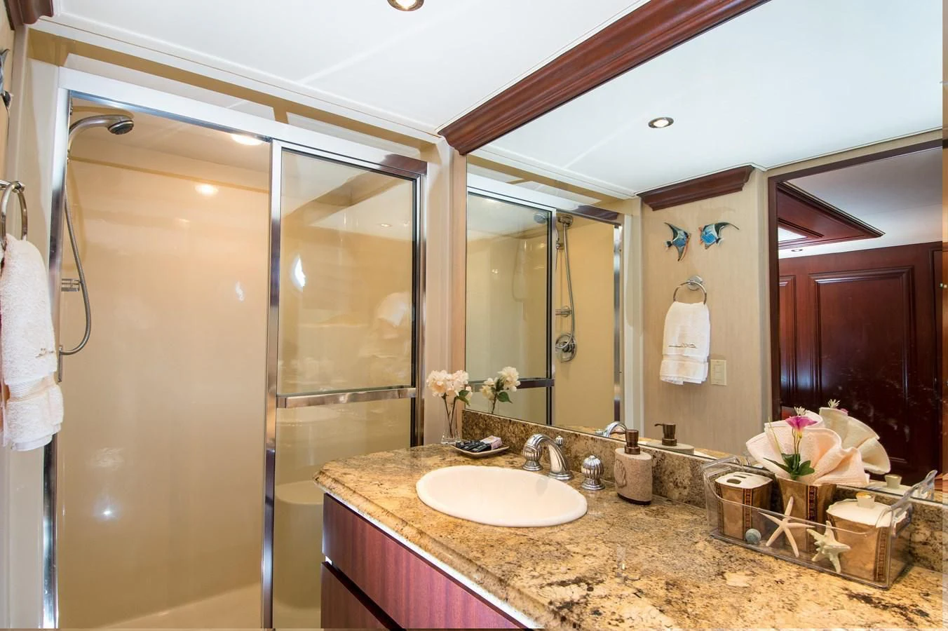 a bathroom with a large mirror aboard THREE KINGS Yacht for Sale