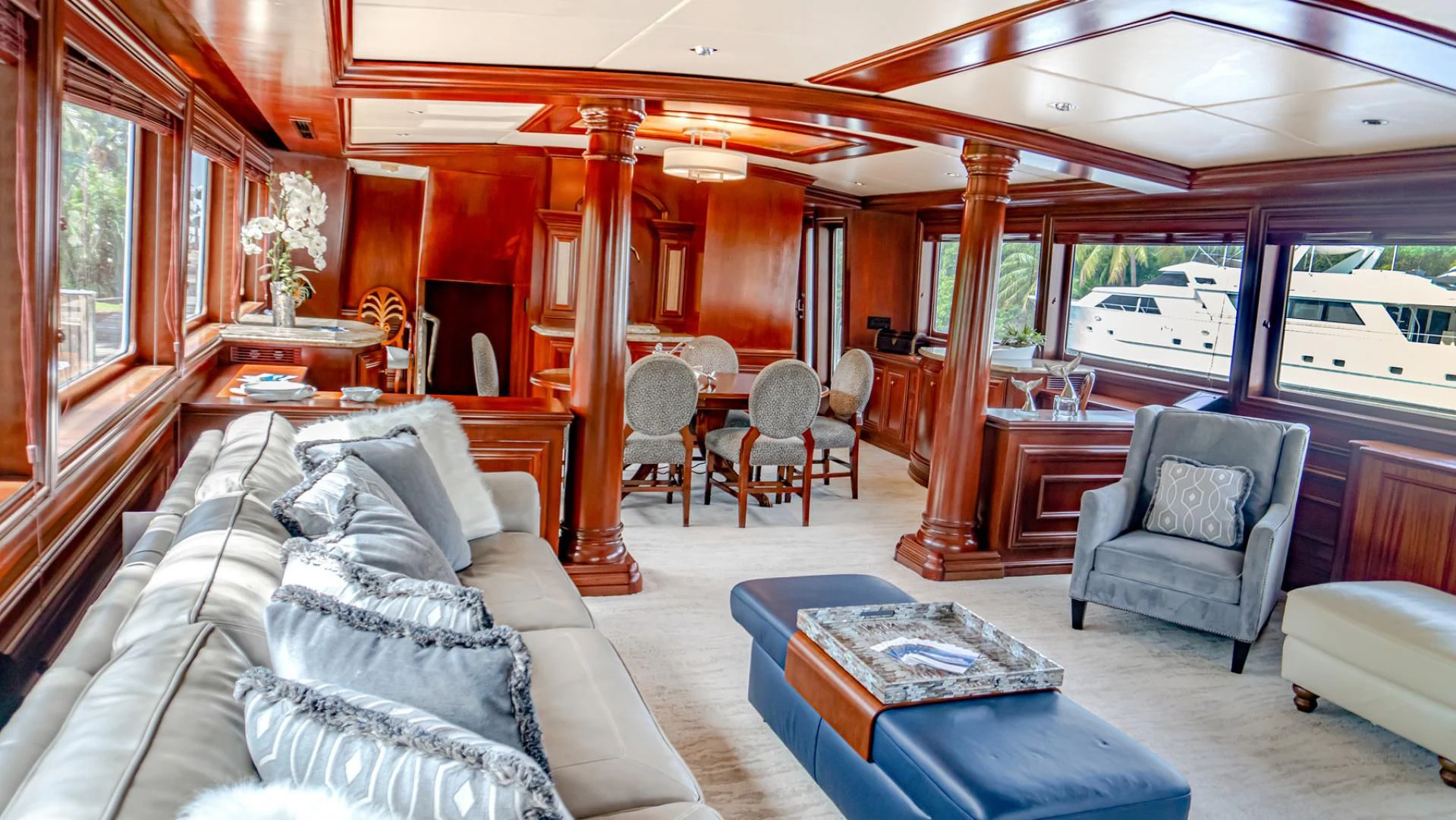 a living room with a couch and a table aboard THREE KINGS Yacht for Sale