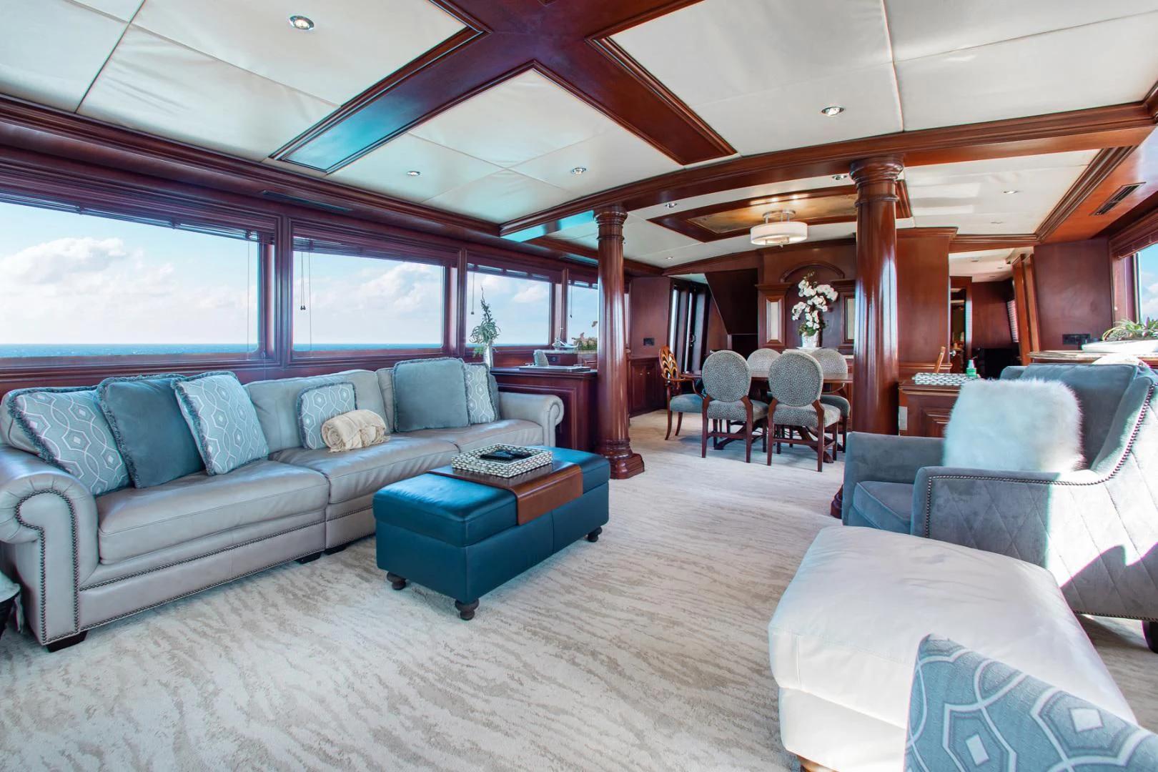 a living room with a couch and a table aboard THREE KINGS Yacht for Sale