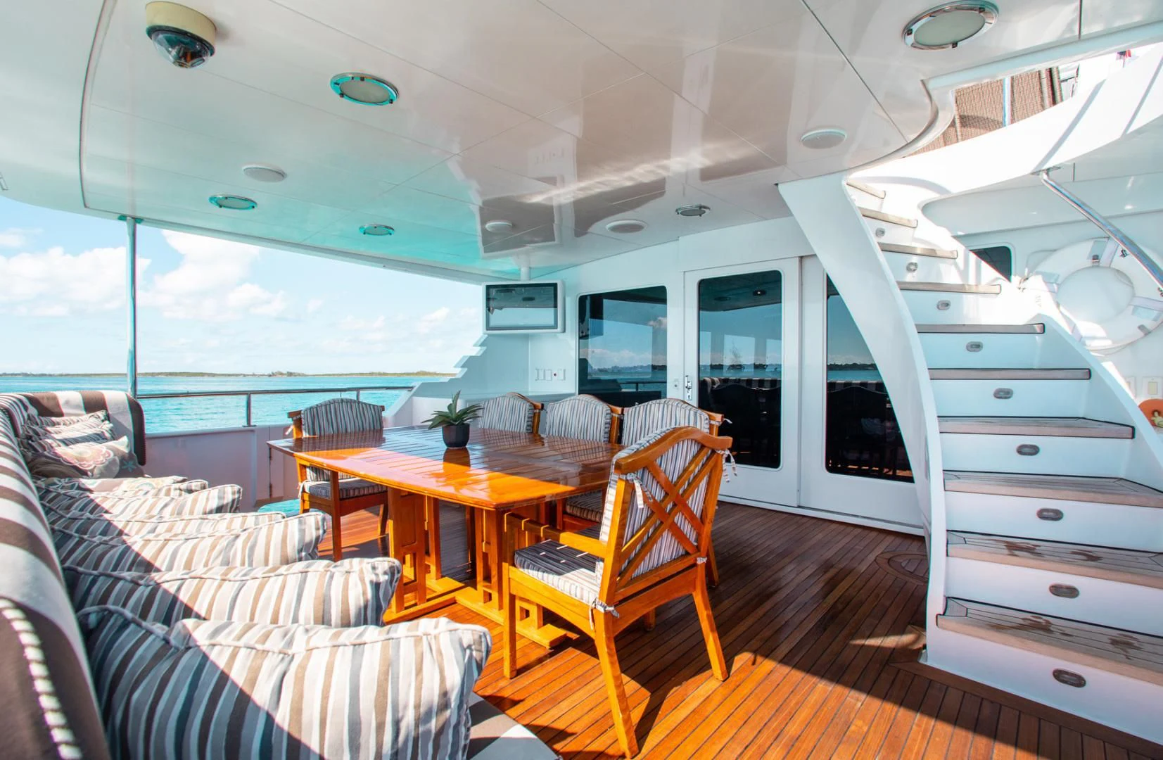 a room with a table and chairs aboard THREE KINGS Yacht for Sale