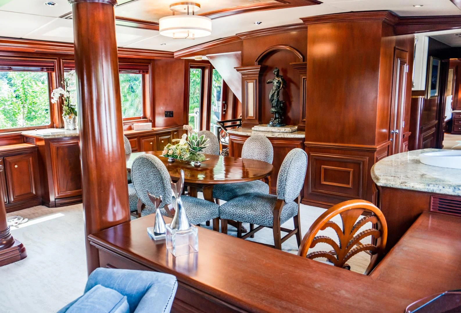 a dining room with a table aboard THREE KINGS Yacht for Sale