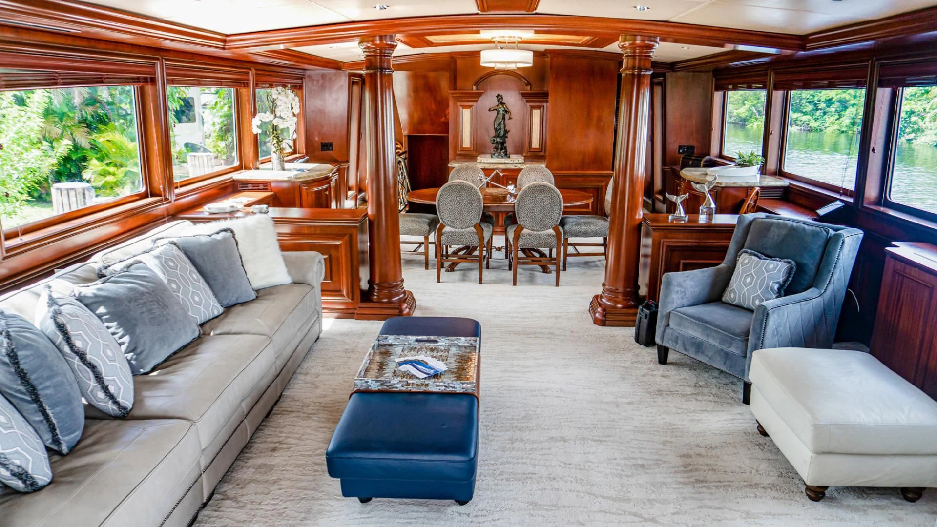 a living room with a couch and a table aboard THREE KINGS Yacht for Sale