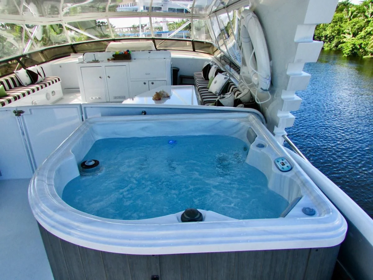 a boat with a blue cover aboard THREE KINGS Yacht for Sale