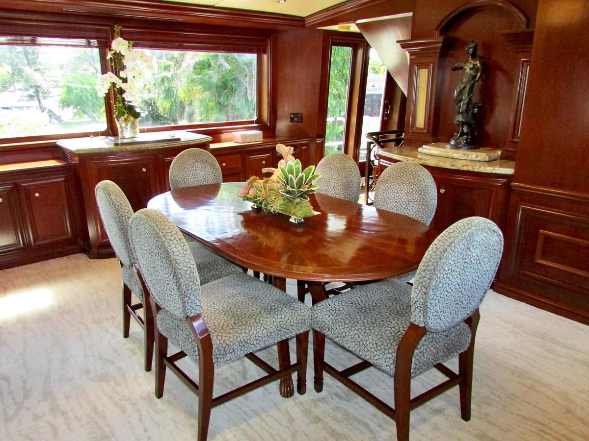 a dining table in a house aboard THREE KINGS Yacht for Sale