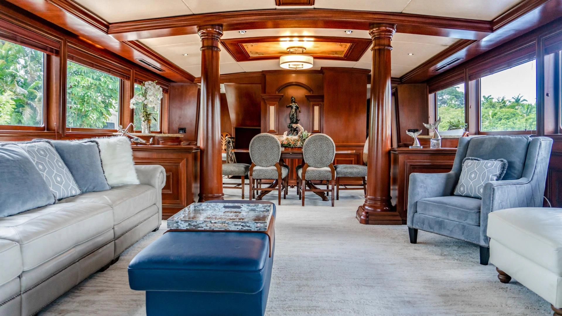 a living room with a couch and a table aboard THREE KINGS Yacht for Sale