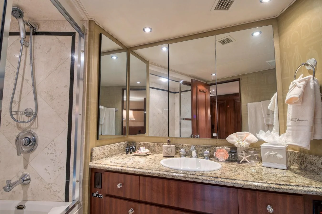 a bathroom with a large mirror aboard THREE KINGS Yacht for Sale