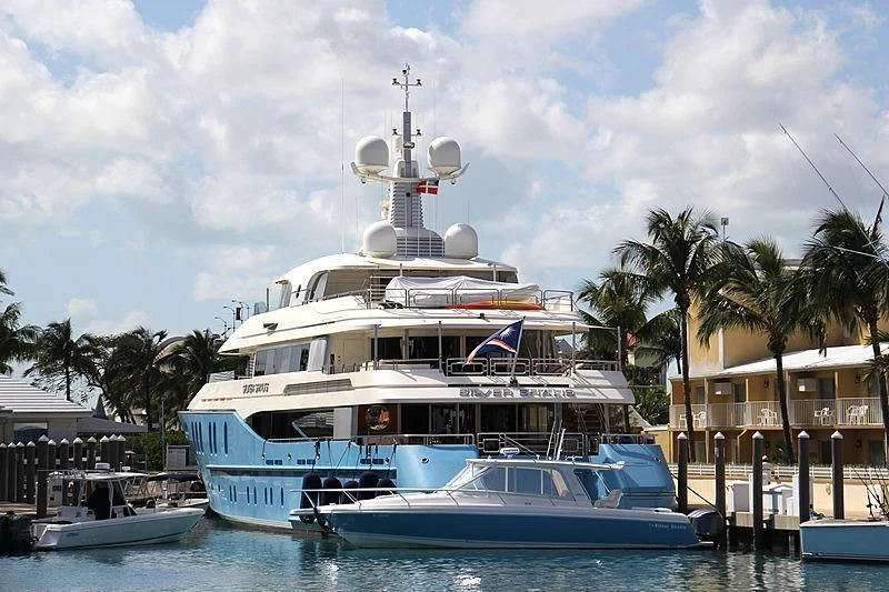 a large white boat in a harbor aboard SILVER SHALIS Yacht for Sale