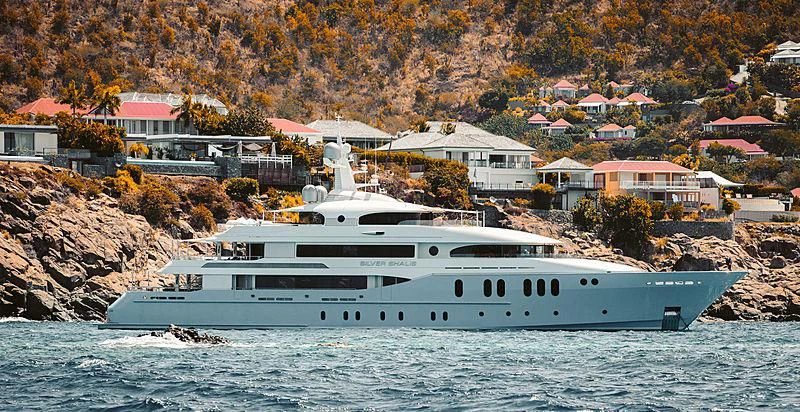 a white boat on the water aboard SILVER SHALIS Yacht for Sale