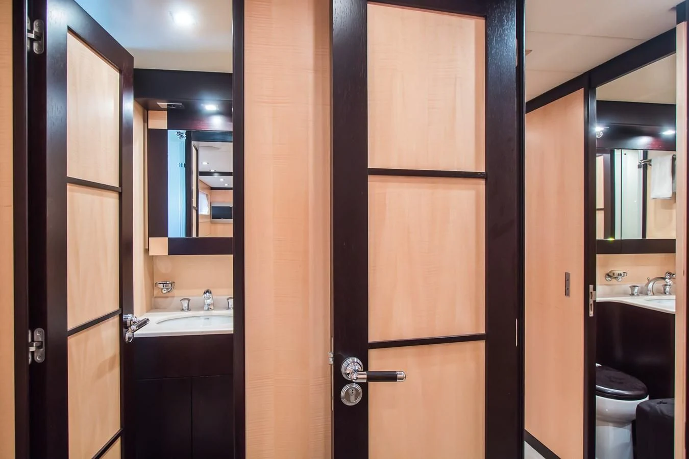 a bathroom with a black door aboard LEOPARD 24M Yacht for Sale
