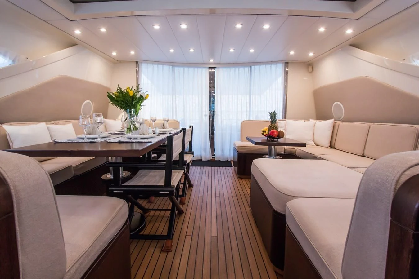 a room with a table chairs and a couch aboard LEOPARD 24M Yacht for Sale