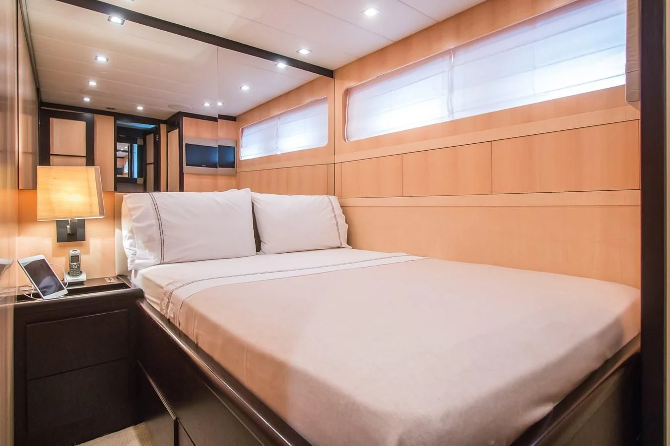 a bed with white sheets aboard LEOPARD 24M Yacht for Sale