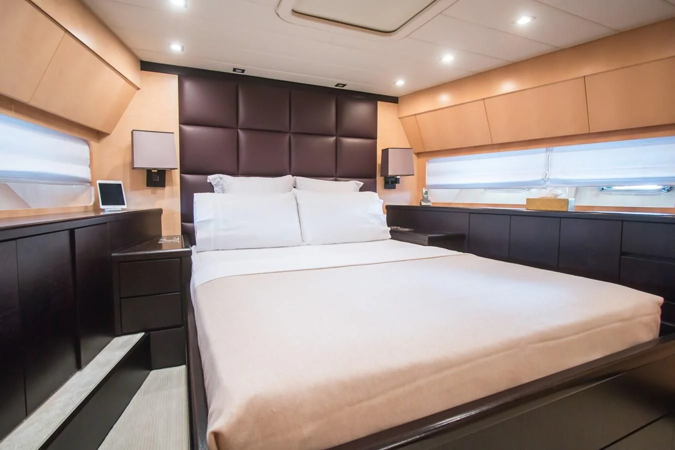 a bed with a laptop on it aboard LEOPARD 24M Yacht for Sale