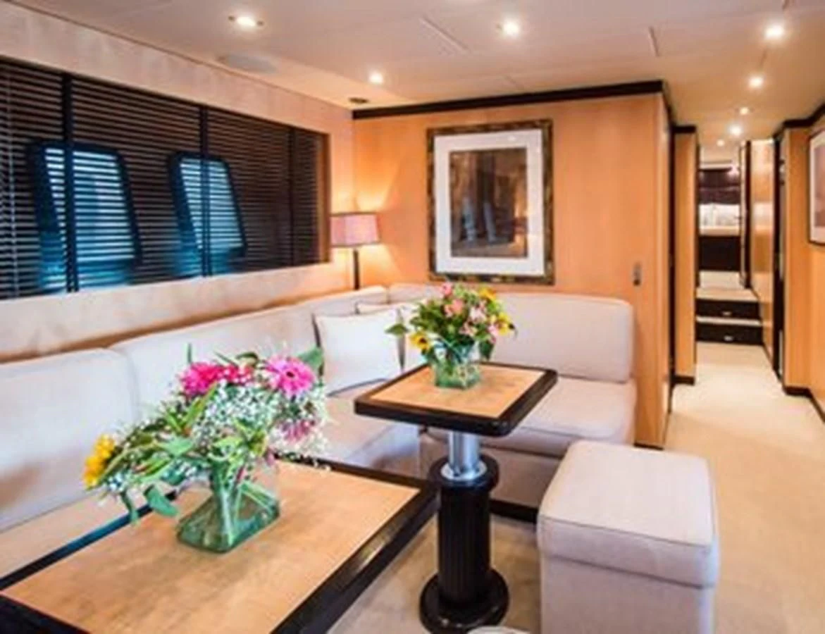 a living room with a table and couches aboard LEOPARD 24M Yacht for Sale