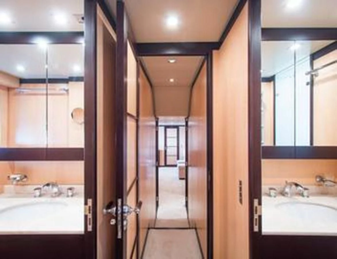 a bathroom with a large mirror aboard LEOPARD 24M Yacht for Sale