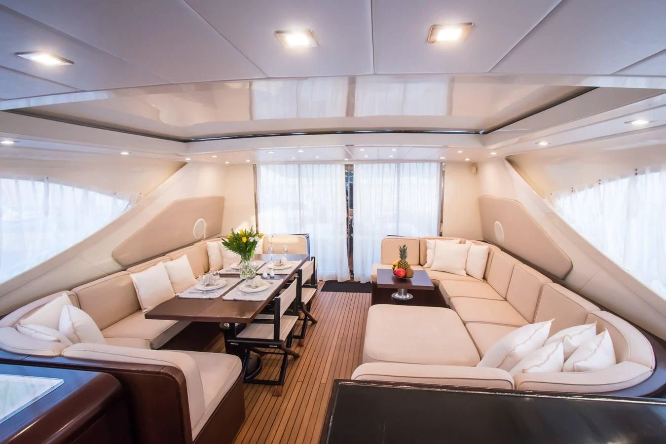 a living room with white couches aboard LEOPARD 24M Yacht for Sale