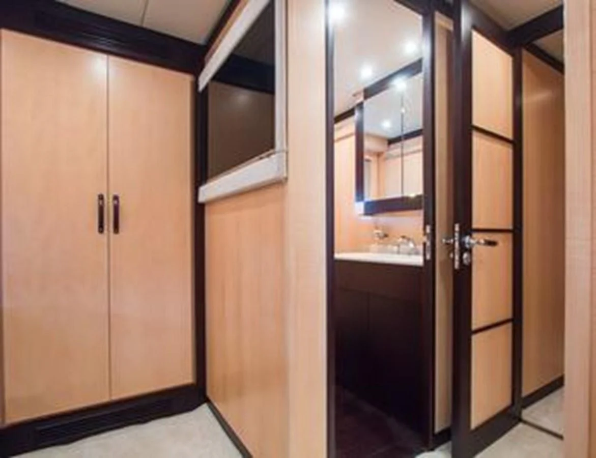a room with wooden doors aboard LEOPARD 24M Yacht for Sale
