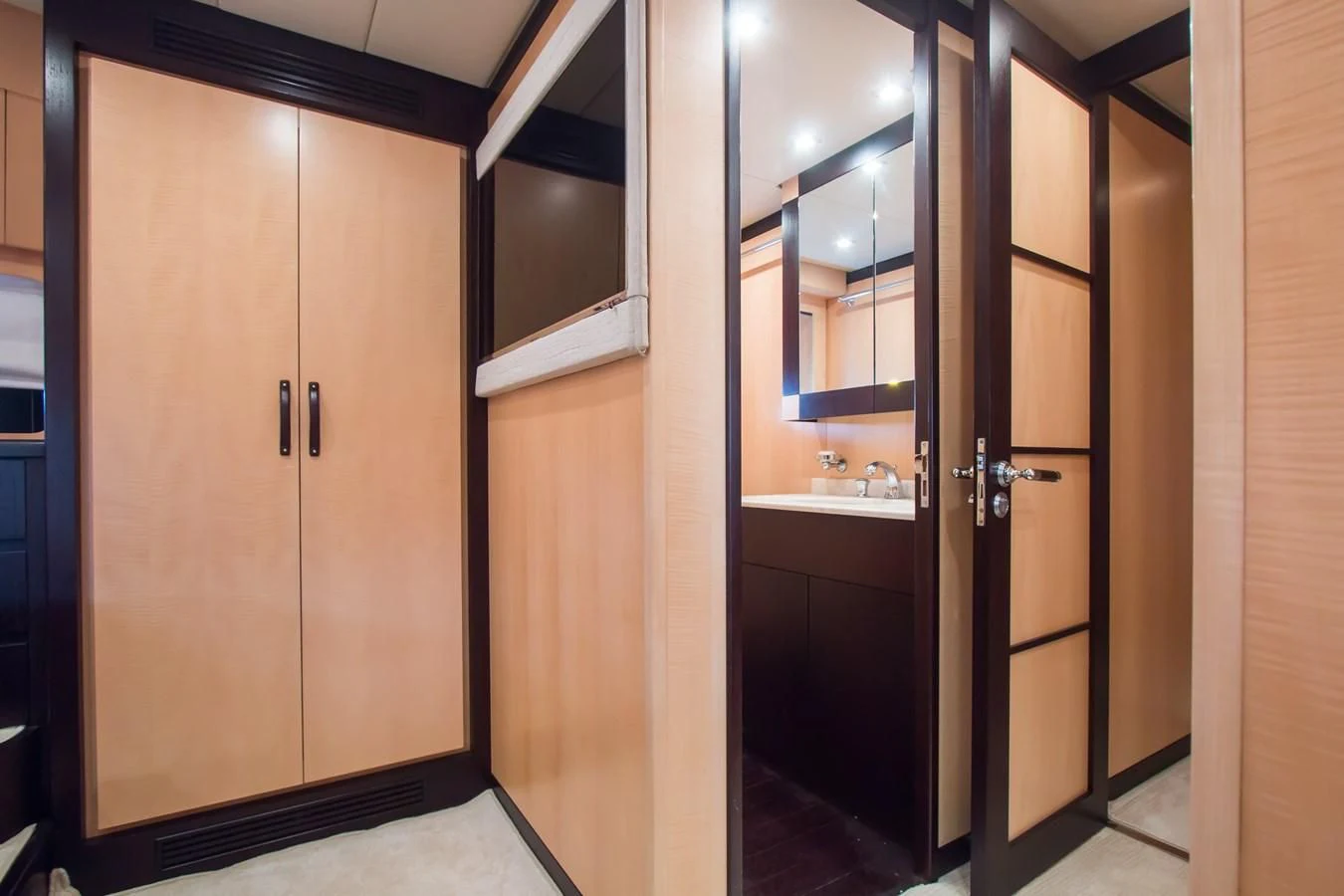 a bathroom with a sink and a mirror aboard LEOPARD 24M Yacht for Sale