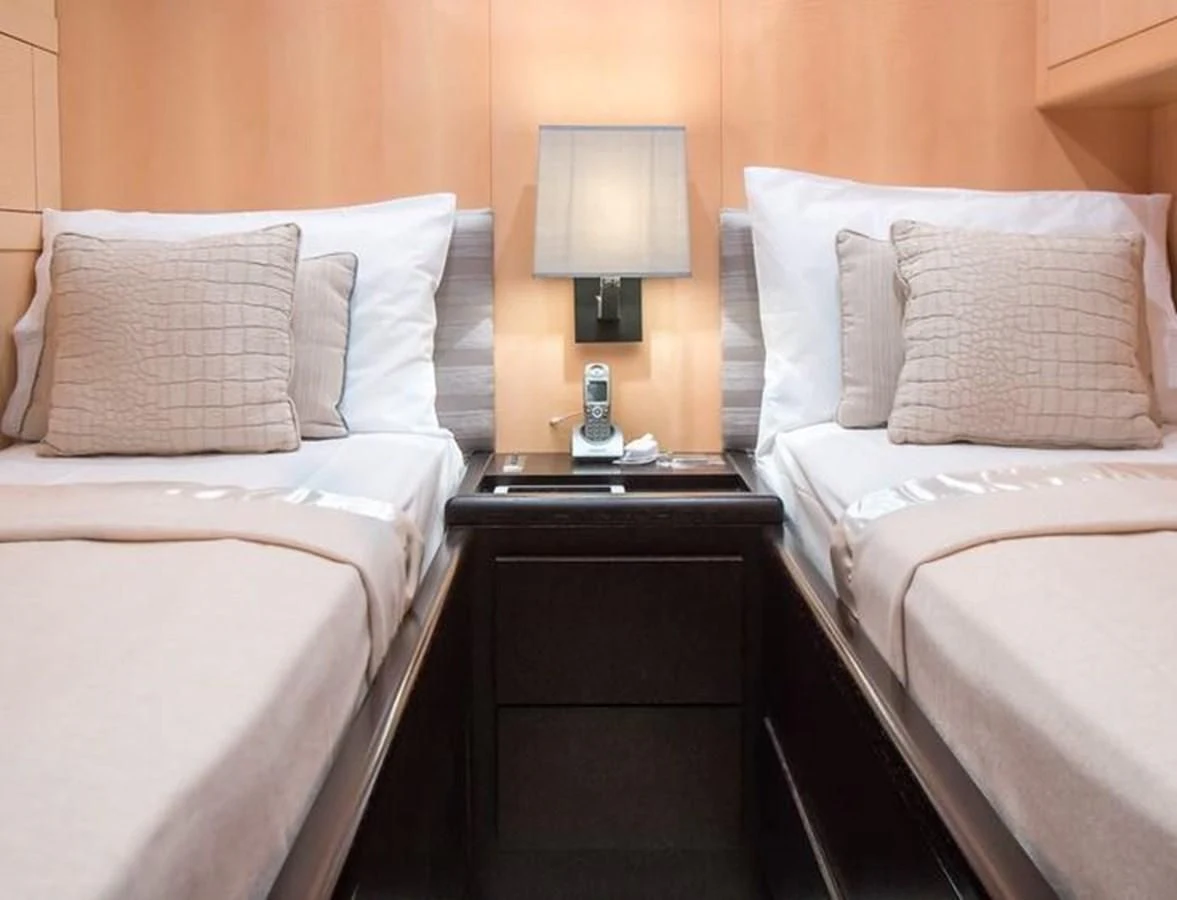 a couple of beds in a hotel room aboard LEOPARD 24M Yacht for Sale