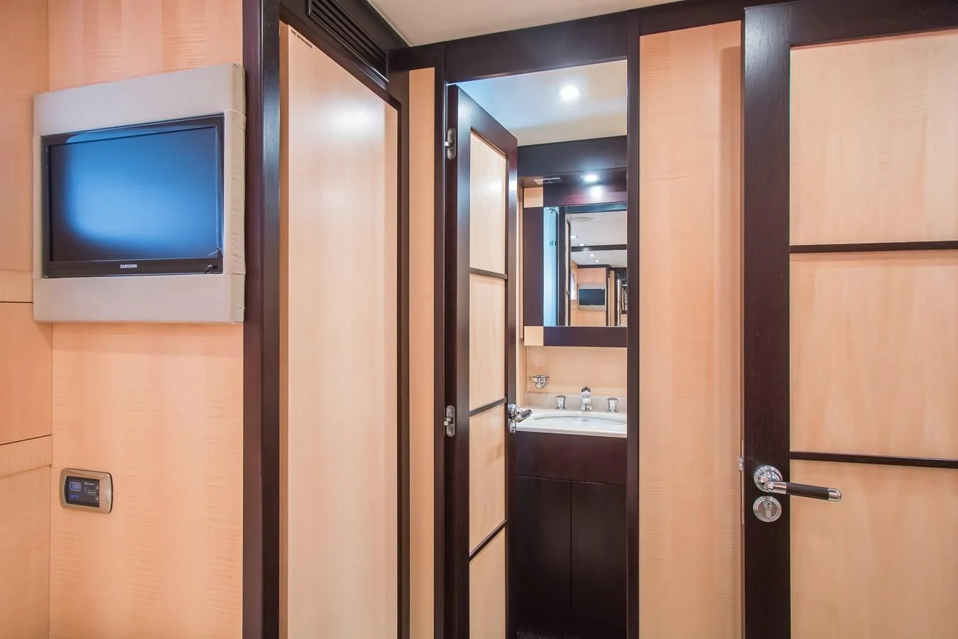 a tv on a wall aboard LEOPARD 24M Yacht for Sale