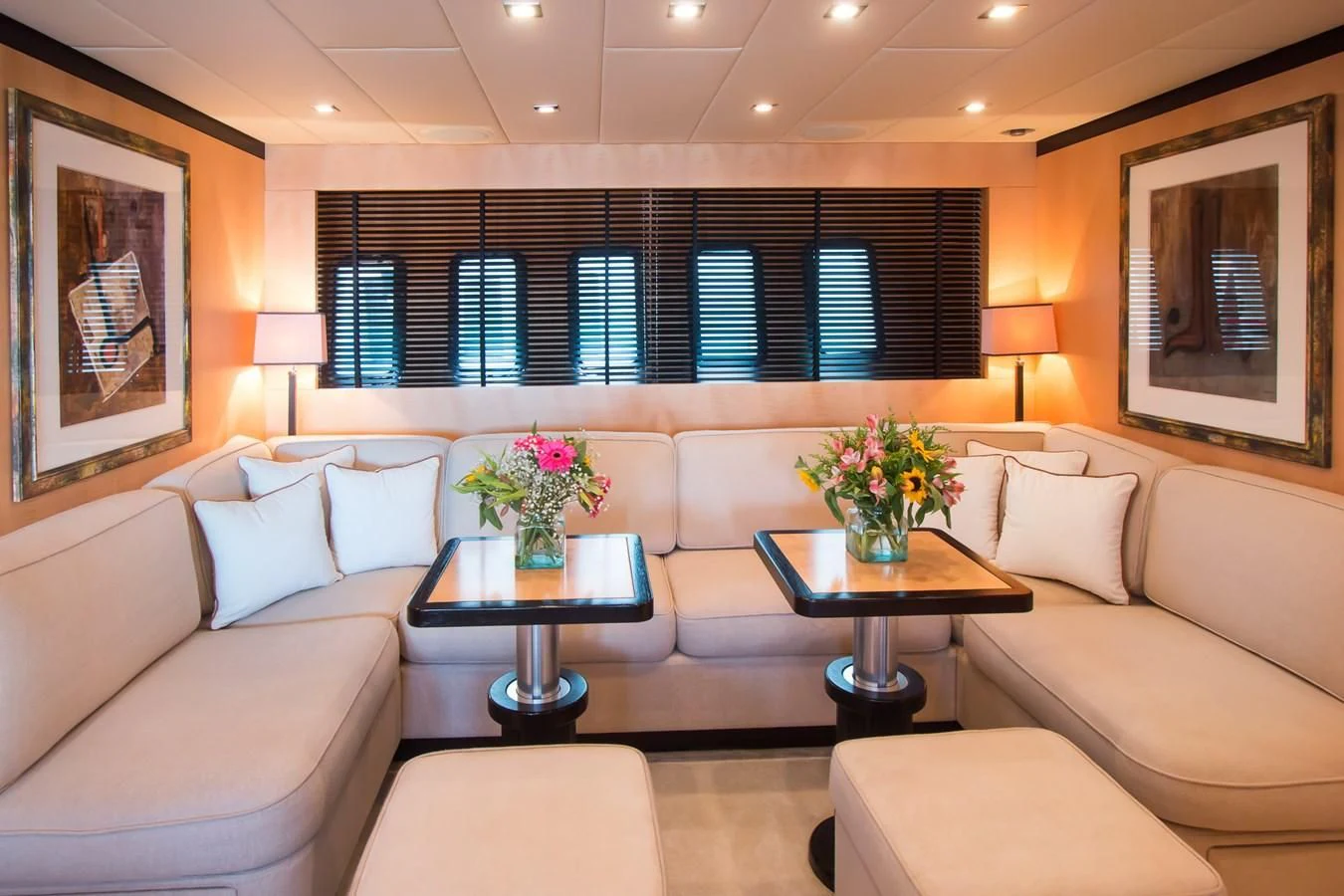 a living room with white couches and a coffee table aboard LEOPARD 24M Yacht for Sale