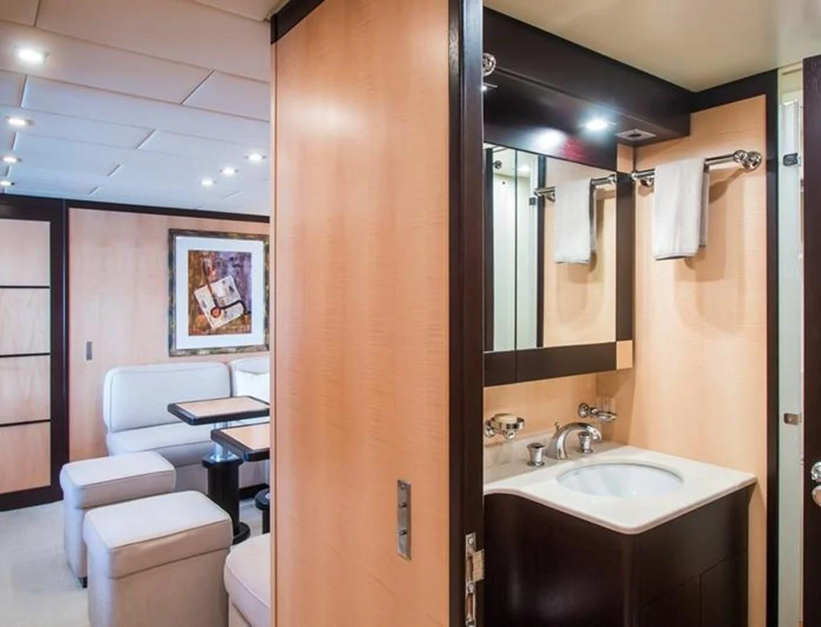 a bathroom with a toilet and sink aboard LEOPARD 24M Yacht for Sale