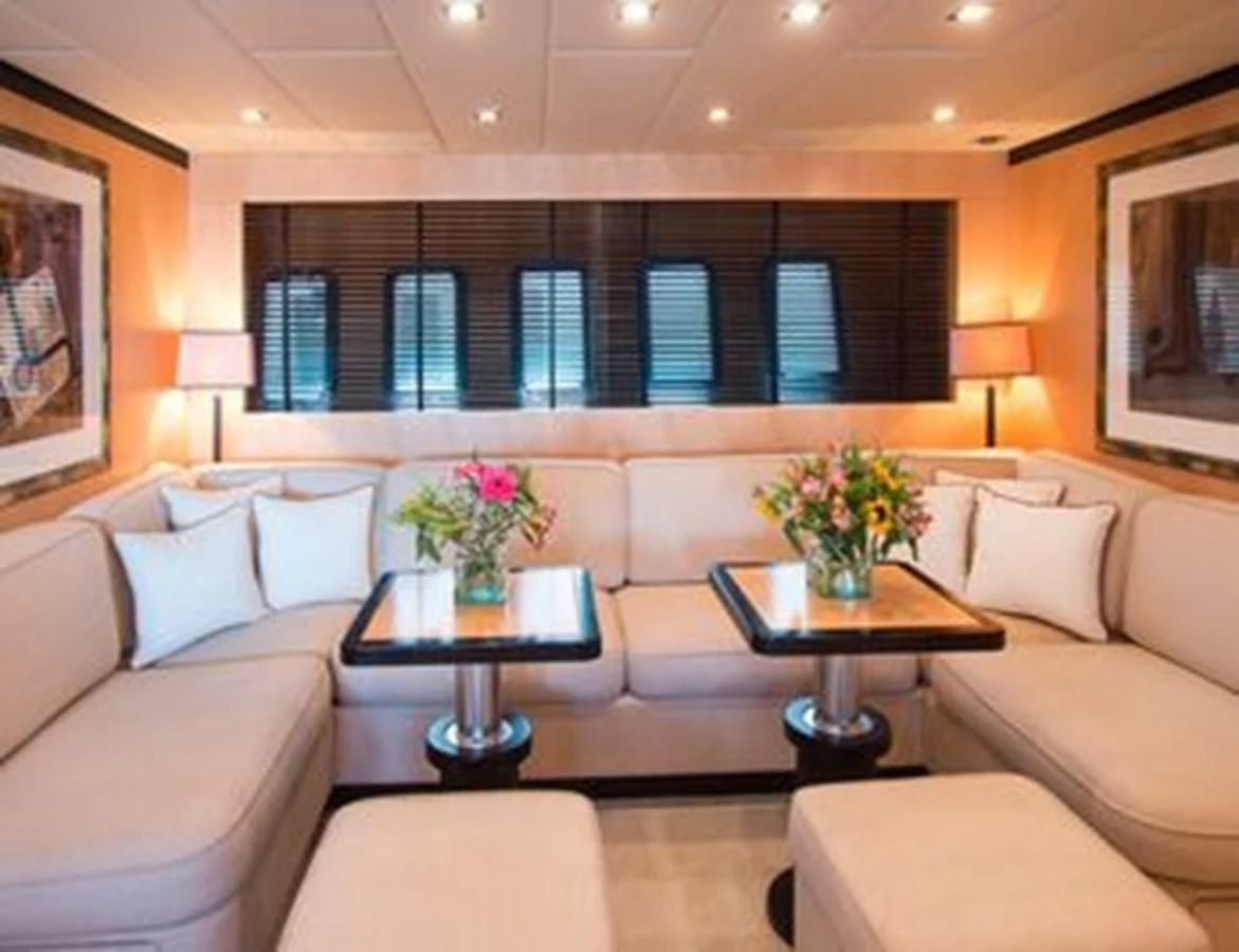 a living room with a couch and a coffee table aboard LEOPARD 24M Yacht for Sale