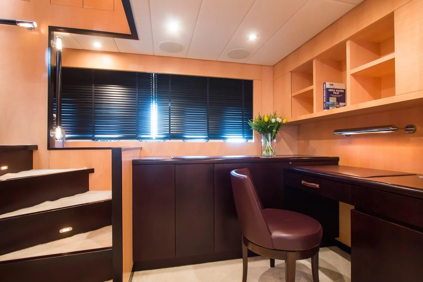 a room with a desk and a chair aboard LEOPARD 24M Yacht for Sale