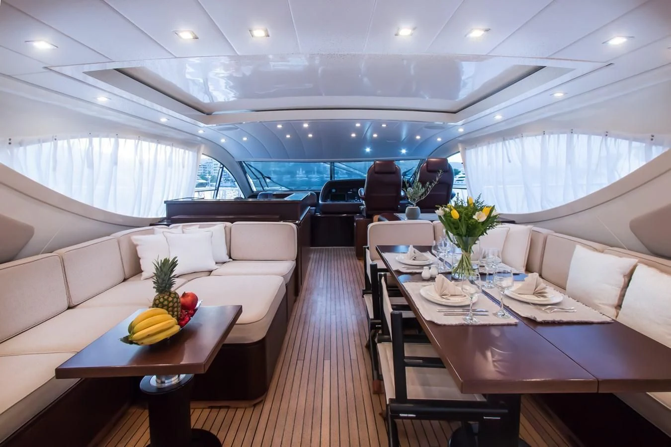 a room with a table and chairs aboard LEOPARD 24M Yacht for Sale