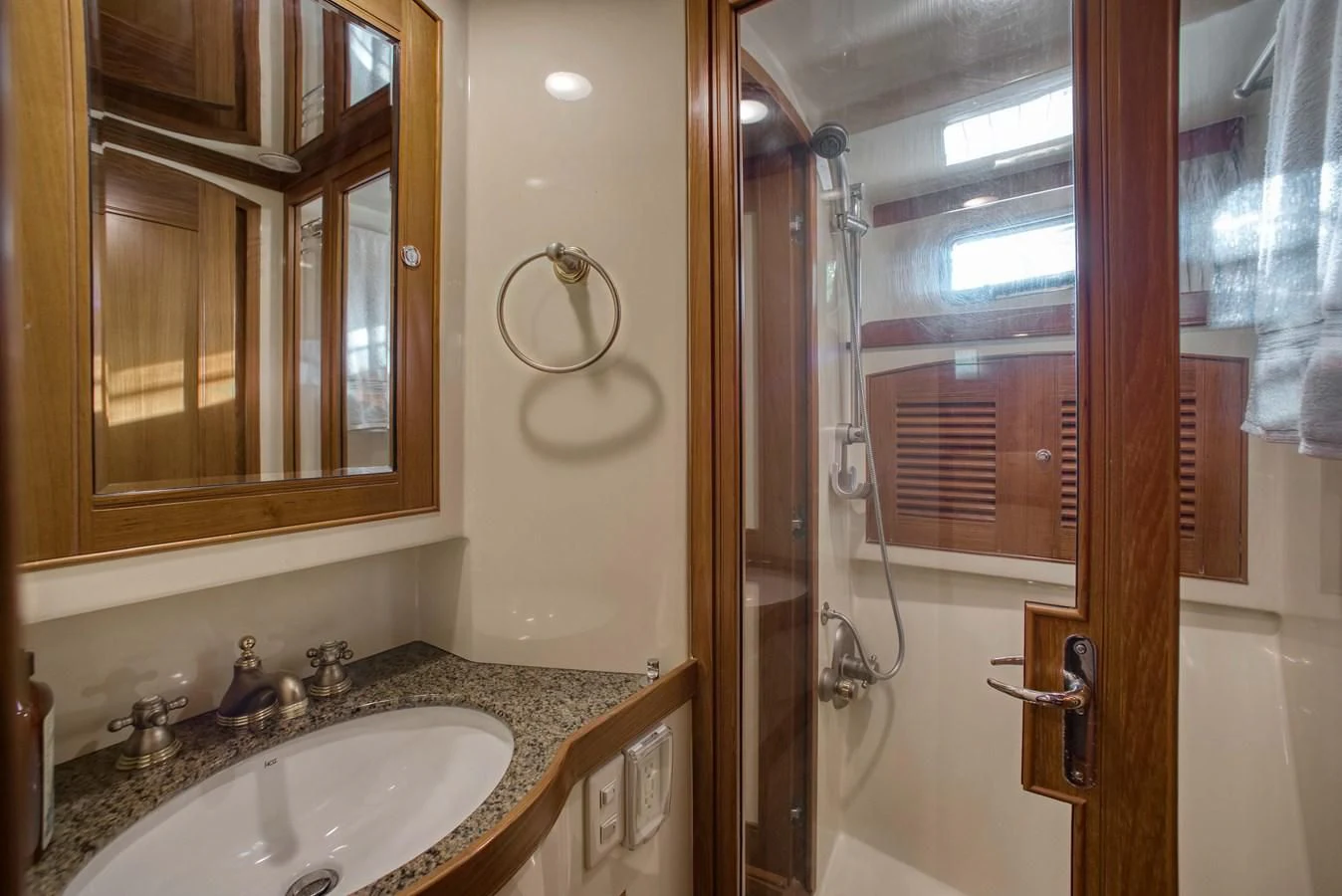 a bathroom with a sink and a shower aboard BLUE ROSY V Yacht for Sale
