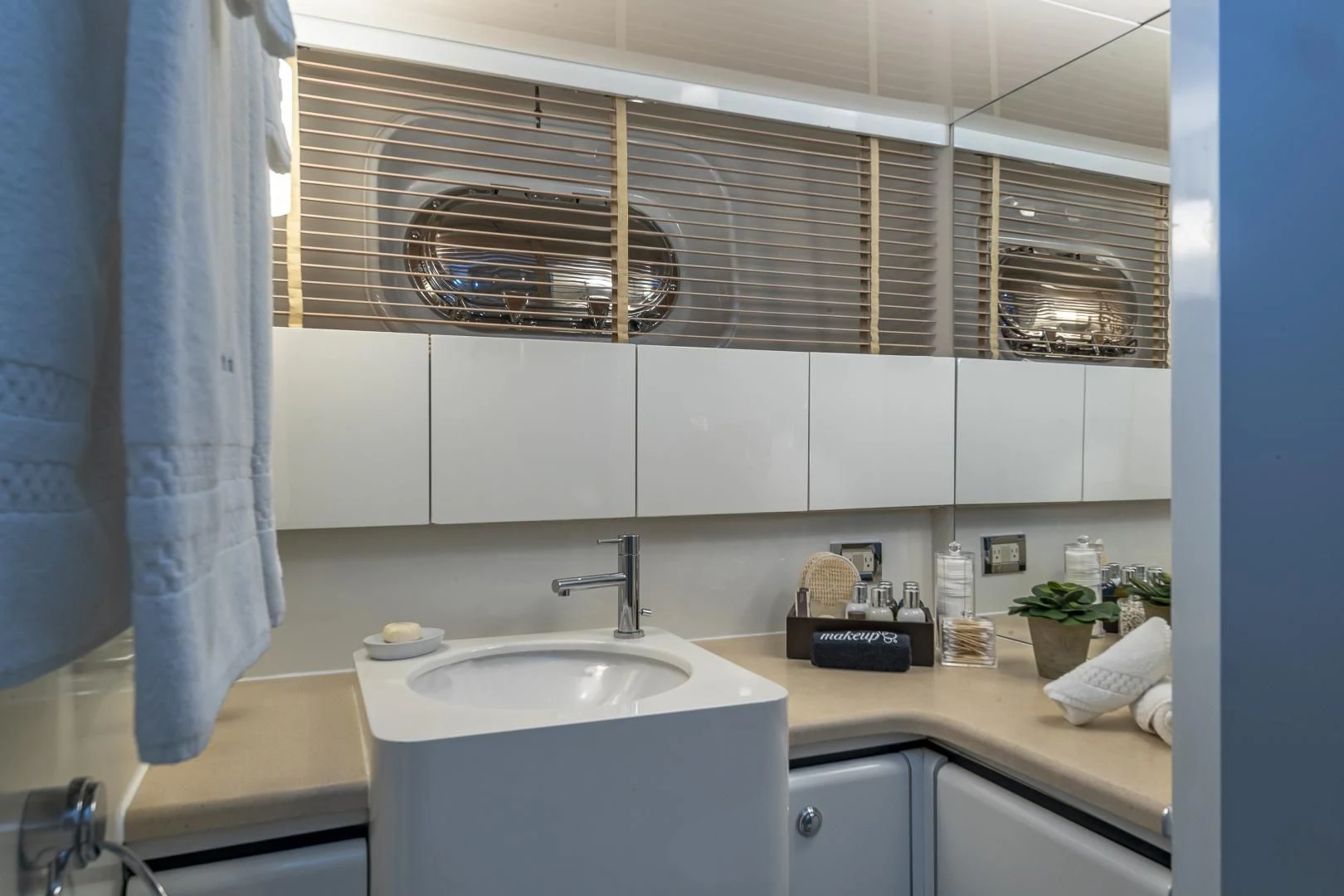 a bathroom with a sink and a window aboard KARTAL YUVASI Yacht for Charter