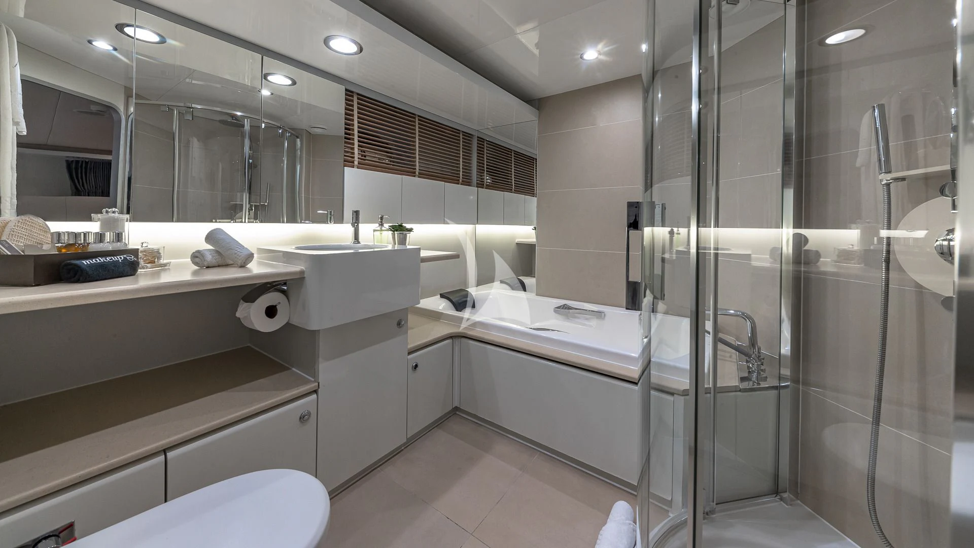 a bathroom with a glass shower aboard KARTAL YUVASI Yacht for Charter
