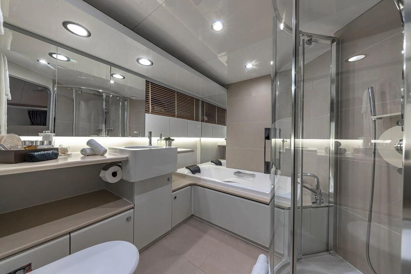 a bathroom with a glass shower aboard KARTAL YUVASI Yacht for Charter