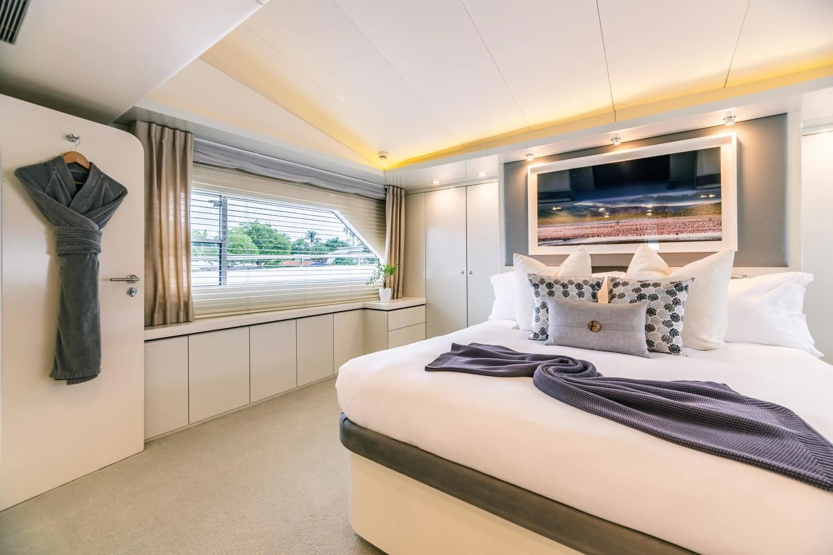 a bedroom with a large bed aboard KARTAL YUVASI Yacht for Charter