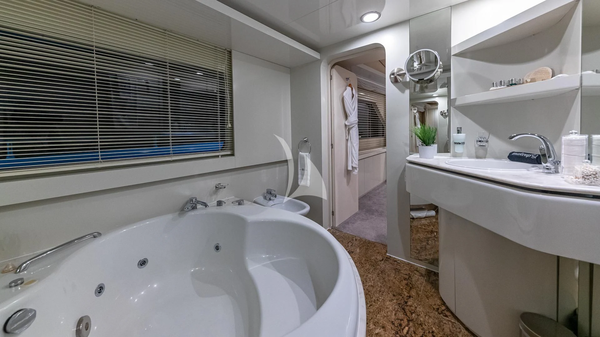 a bathroom with a sink and a mirror aboard KARTAL YUVASI Yacht for Charter