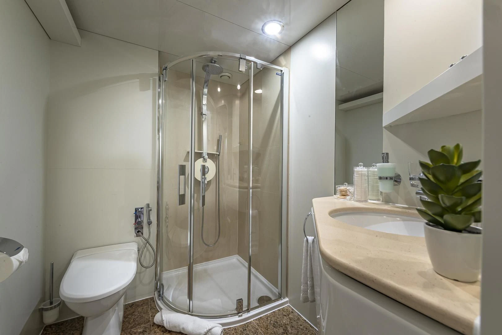 a bathroom with a glass shower aboard KARTAL YUVASI Yacht for Charter