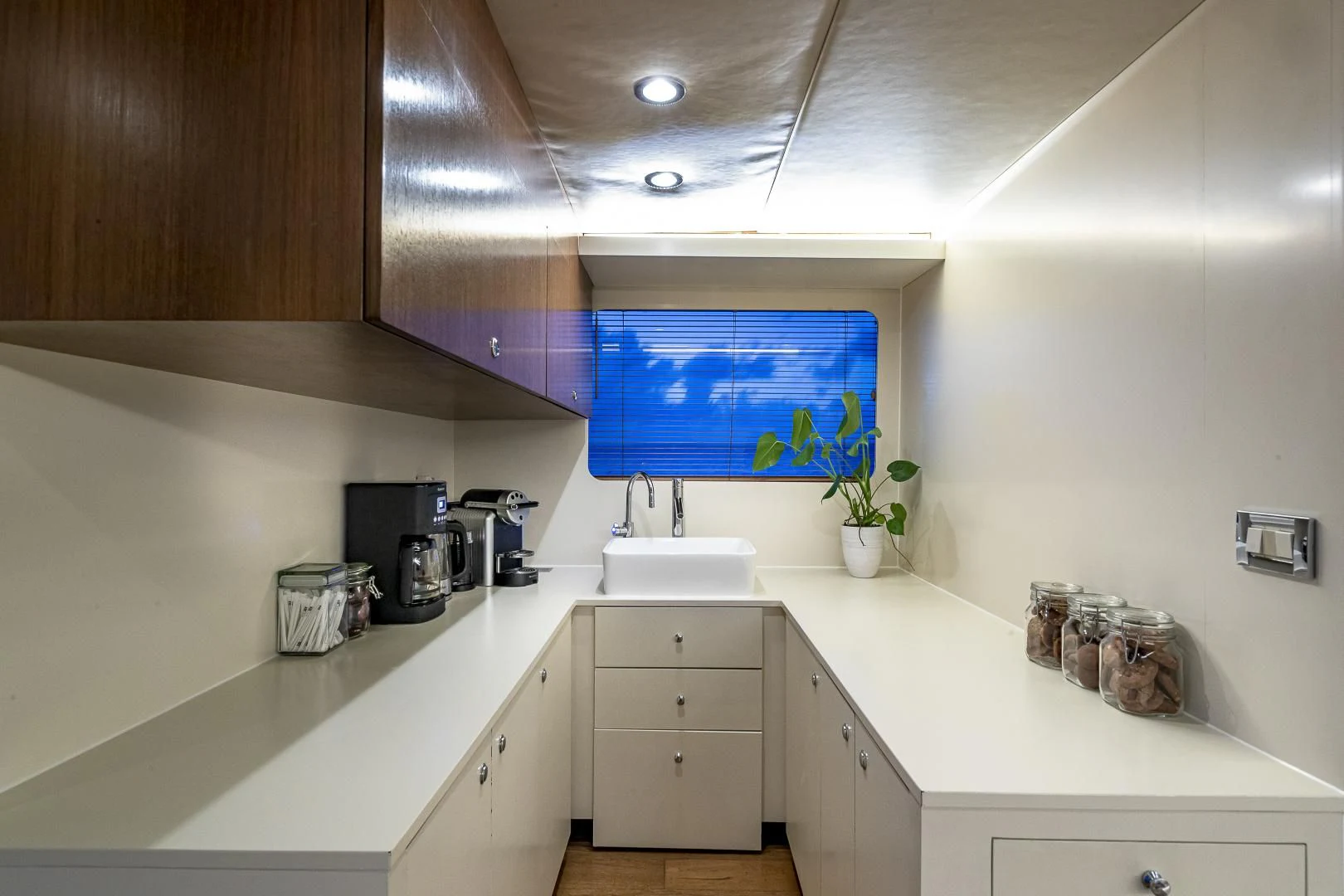a kitchen with white cabinets aboard KARTAL YUVASI Yacht for Charter