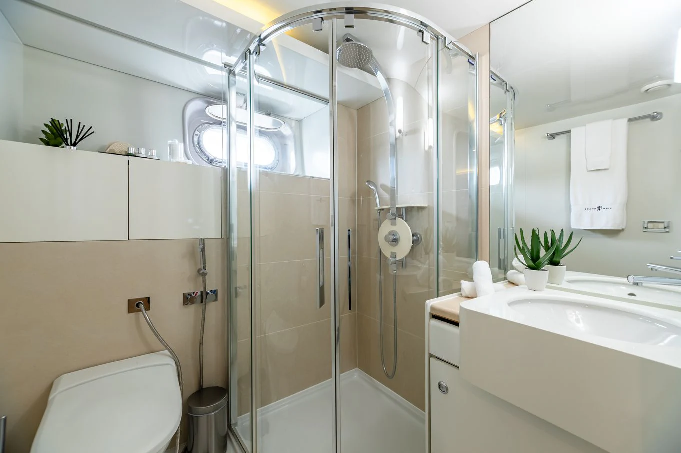 a bathroom with a glass shower aboard KARTAL YUVASI Yacht for Charter