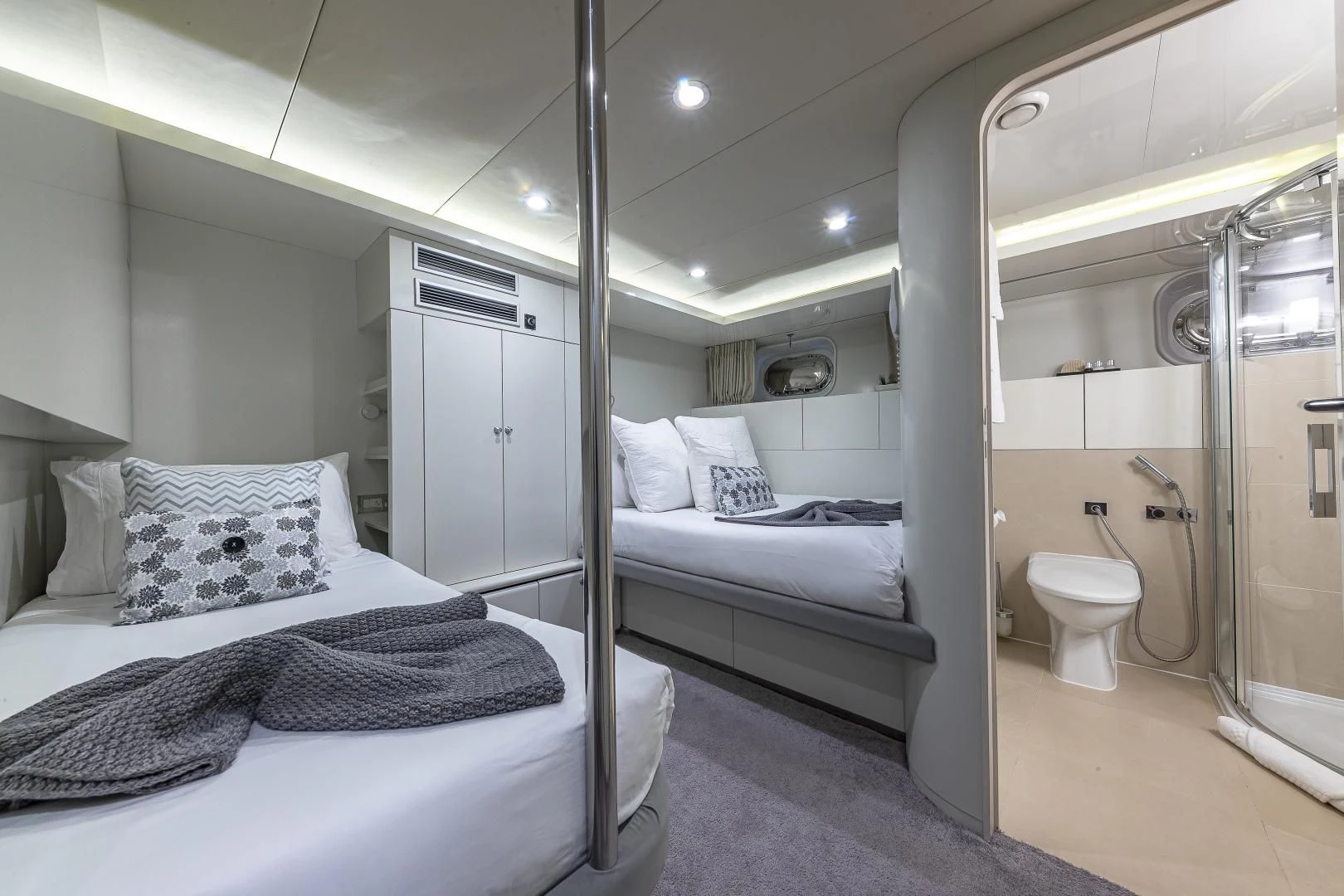 a room with a bed and a mirror aboard KARTAL YUVASI Yacht for Charter