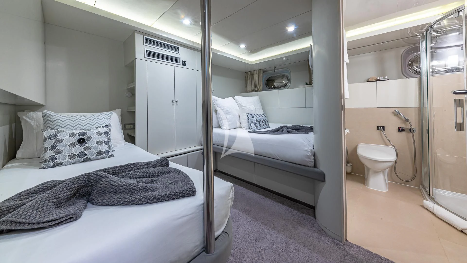 a room with a bed and a mirror aboard KARTAL YUVASI Yacht for Charter