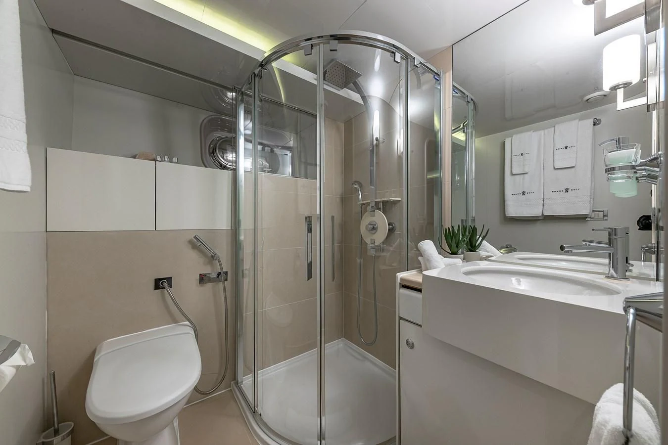 a bathroom with a glass shower aboard KARTAL YUVASI Yacht for Charter